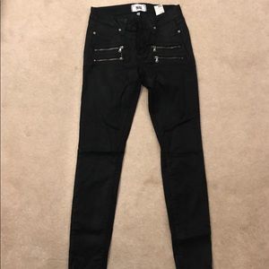 Black skinny coated moto jeans